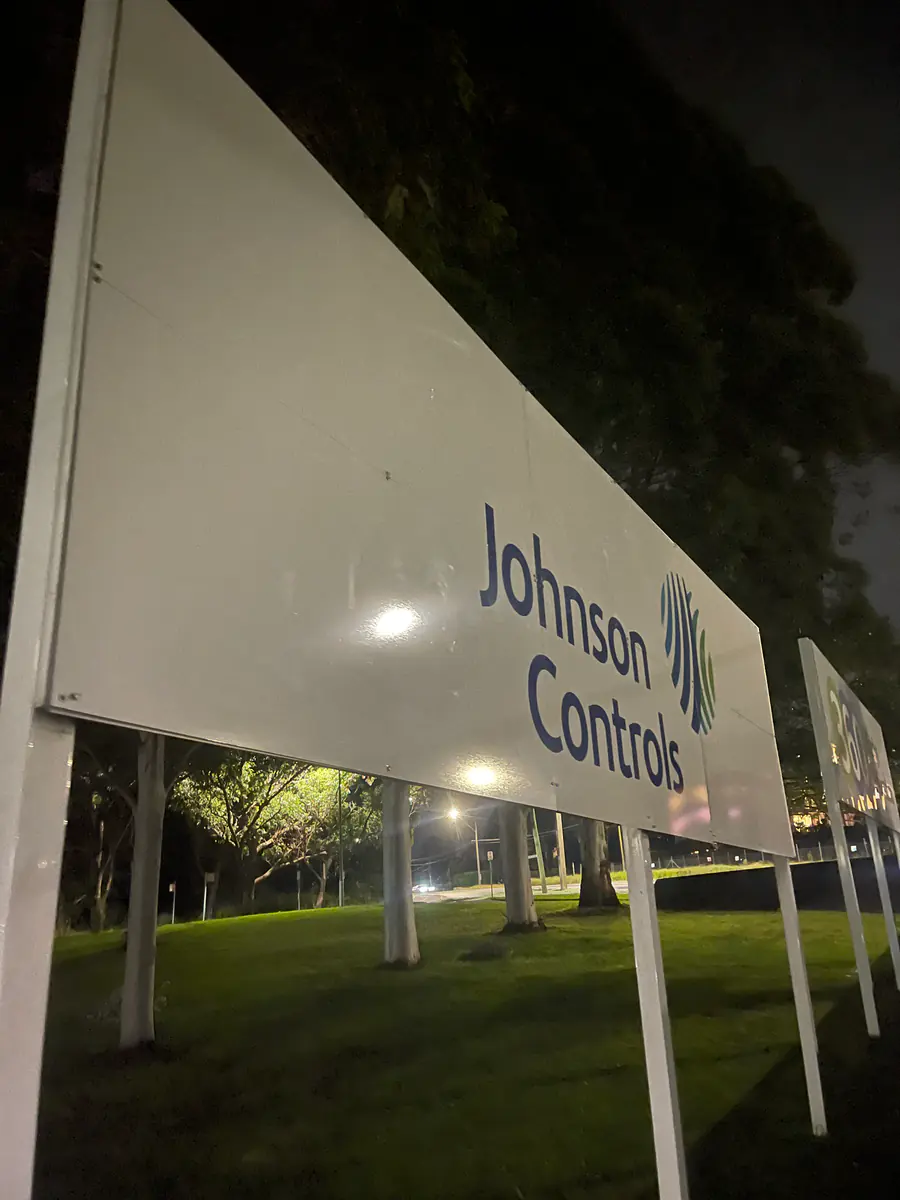 Johnson Controls exterior corporate identification signage at night